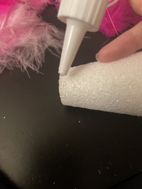 putting the craft glue onto the cone