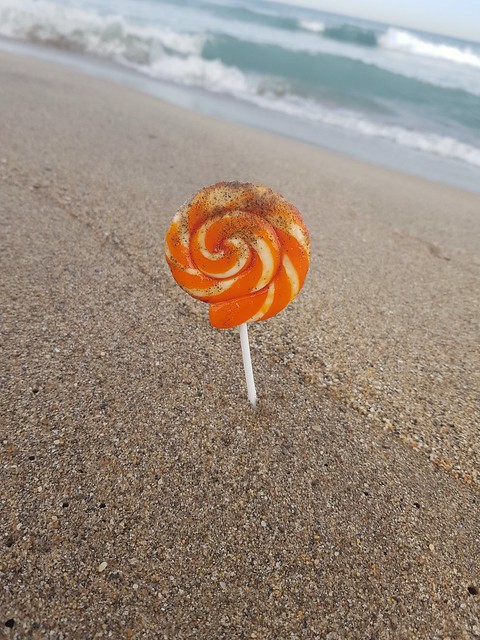 A lollipop meeting the sea through its sand ...
