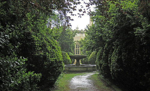 Fountain in the dense green garden of Newstead Abbey in England