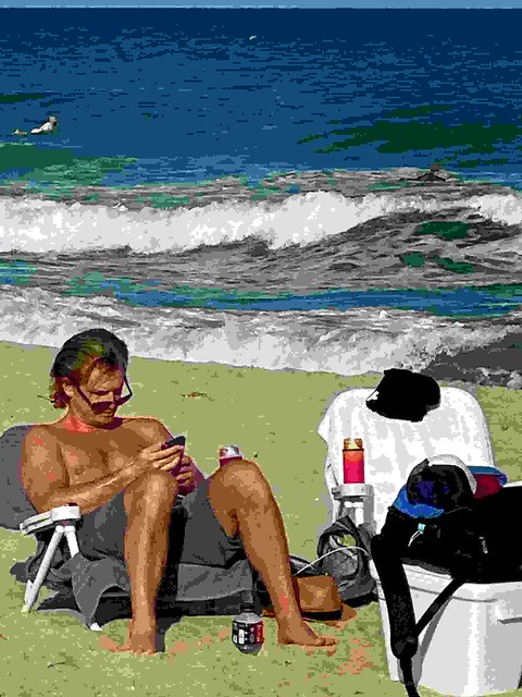 Man on Beach reading