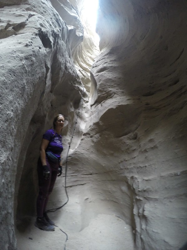 Vicki stops at yet another long knotted rope in Rope Canyon - but this one isn't quite as vertical a climb