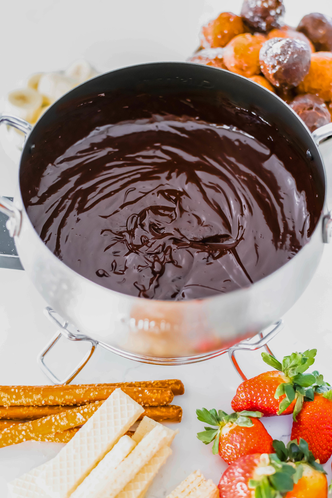 Serve Chocolate Orange Fondue, a fun twist on the classic chocolate fondue, for Valentine's Day dessert. Prepared in minutes with the perfect chocolate orange flavor combo.