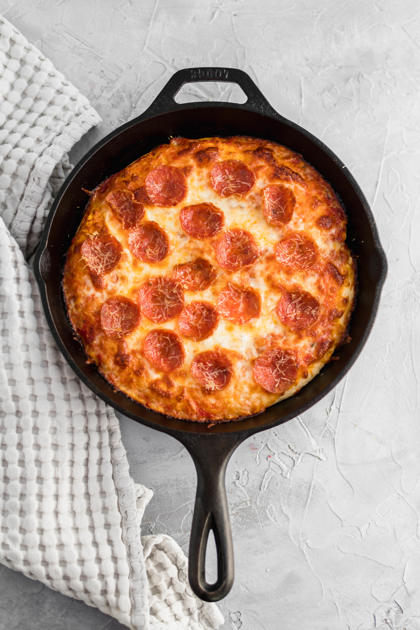Movie night just got a whole lot better with this Cast Iron Skillet Pizza. It has the perfect crispy bottom and is topped with your favorite pizza toppings.