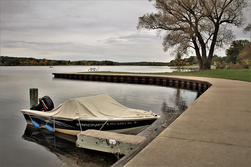 landscape scenery lake water trees october fall boat dock park green gray tree outside outdoors