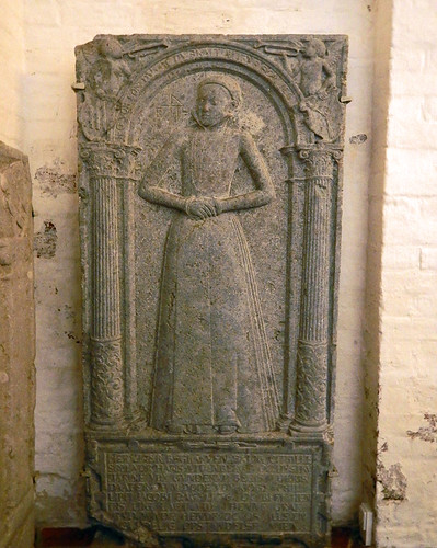 Tombstone with a raised relief of a woman in the church in a medieval town in Denmark