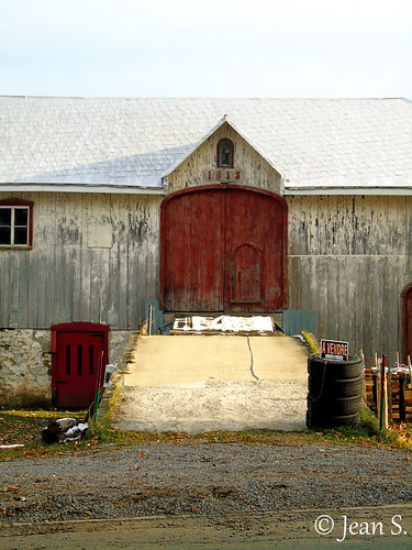 barn door rural sky clouds old tire doors red wood