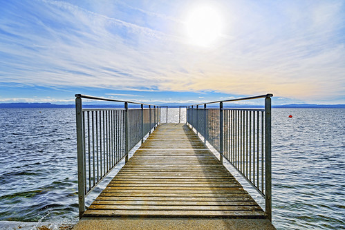The pier, bridge buoy clouds cold d5 hills horizon lake landscape neuchâtel nikon pier scenery serrières shore sky sunny surface switzerland symmetrical symmetry view water waves winter