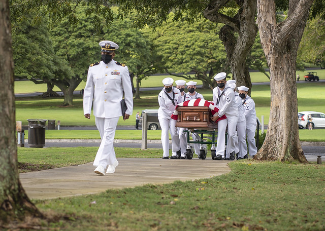 Sailors conduct a funeral  at the National Memorial Cemetery of the Pacific, Honolulu, Hawaii for a WWII veteran