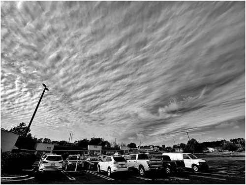 clouds sky shoppingcenter parkinglot cars stores iphone12 snapseed rnifilms stevefrenkelphoto overcastskies