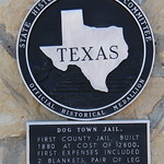 Old Dog Town Jail (Tilden, Texas) Historical marker for the old 1880 jail in Tilden, Texas.  The plaque reads:

Dog Town Jail - First County Jail, built 1880 at cost of $2800. First expenses included 2 blankets, pair of leg irons, 2 pairs handcuffs. Recorded Texas Historic Landmark, 1966.