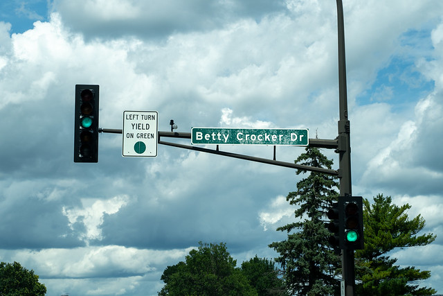 Golden Valley, Minnesota - July 21, 2019:  A Road sign and stoplight for Betty Crocker Drive, named for the nearby General Mills headquarters in suburban Minneapolis, Minnesota.
