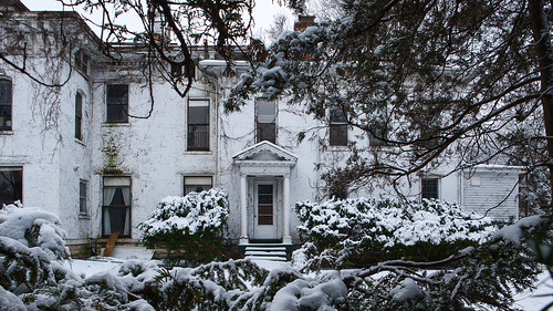 old decrepit oldhouse mansion overgrowth snow frozen derelict