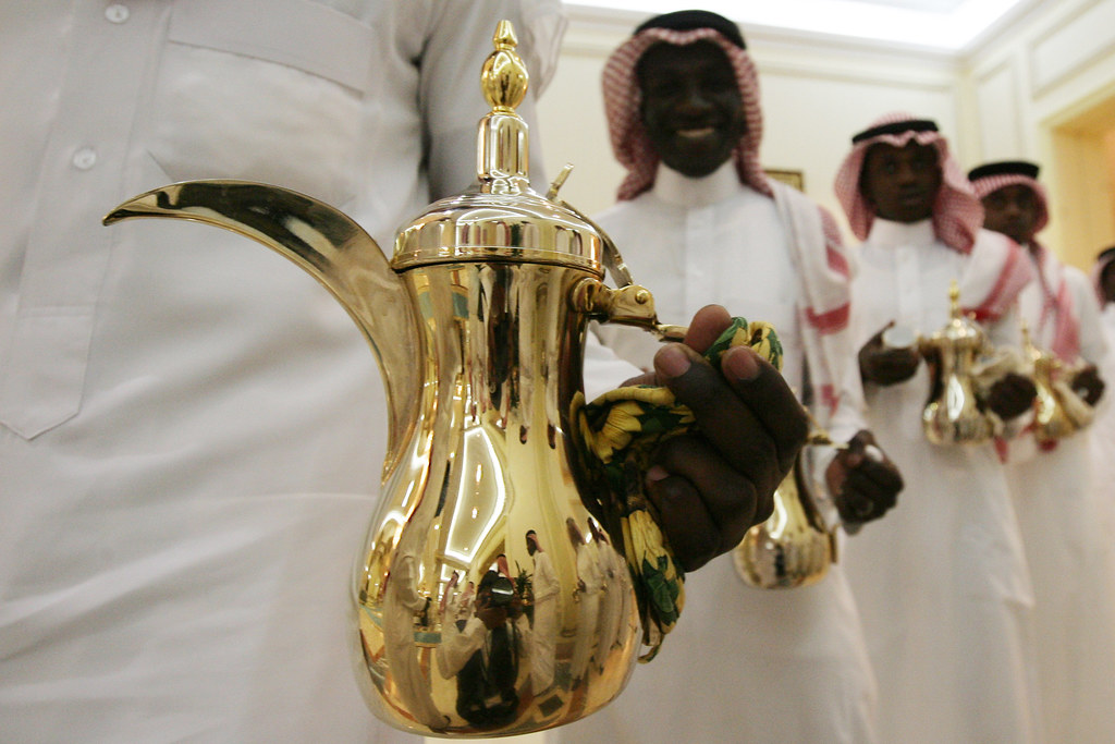 Saudi Arabia - Yemeni waiters hold arabesque coffee pots, wa… - Flickr
