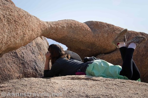 Lying under Lathe Arch, Alabama Hills National Recreation Area, California