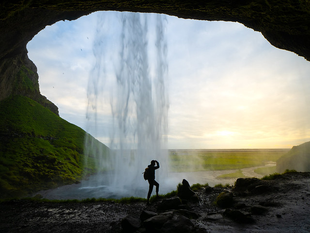 Sunset under Seljalandsfoss waterfall in Iceland