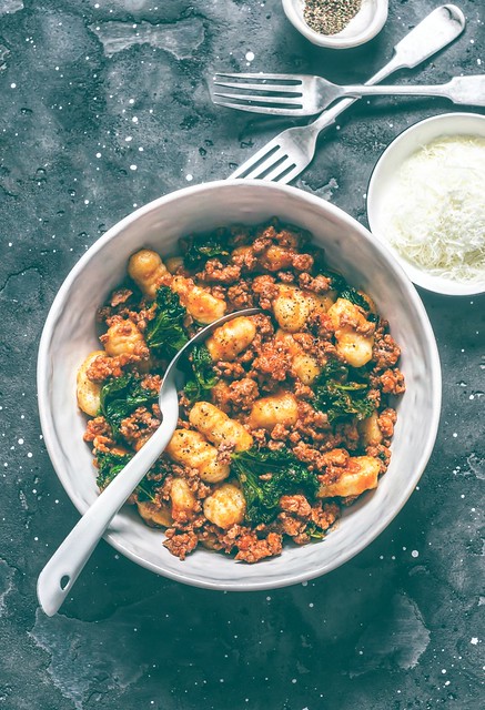 Homemade potato gnocchi with bolognese sauce and kale...