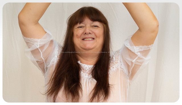 Naughty Grandma poses in white negligee. Polite comments are welcome.