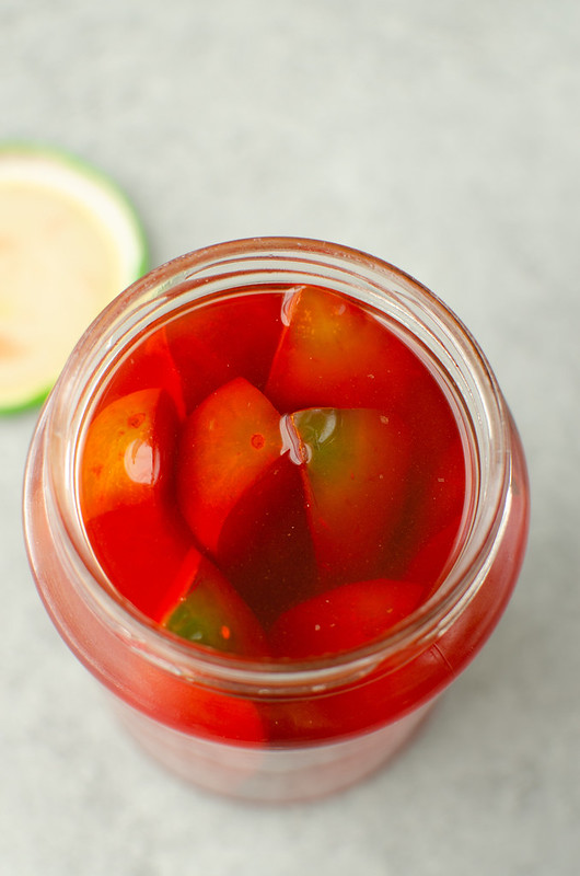 Overhead shot of cherry Kool Aid Pickles in jar
