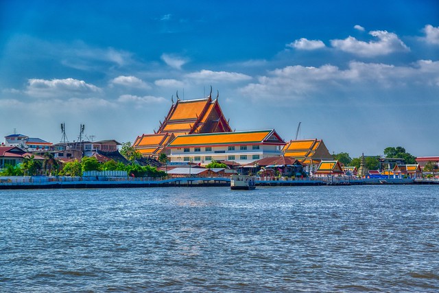 Wat Kanlayanamit Woramahawihan by the Chao Phraya river in Bangkok, Thailand