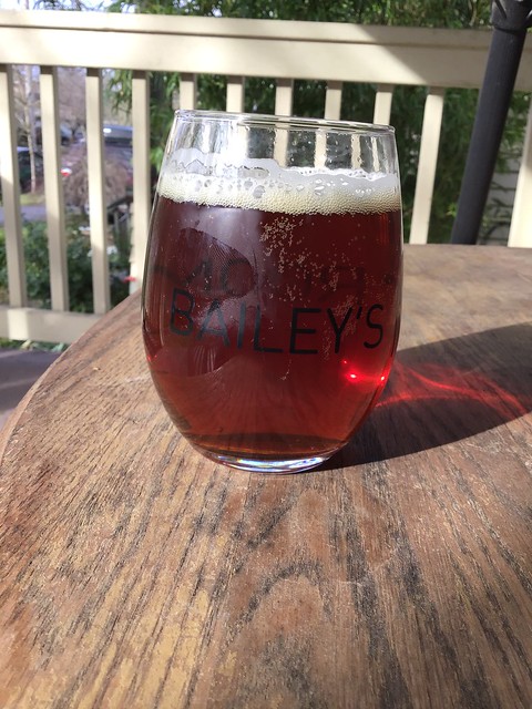 Sasquatch red ale in glass on table outside