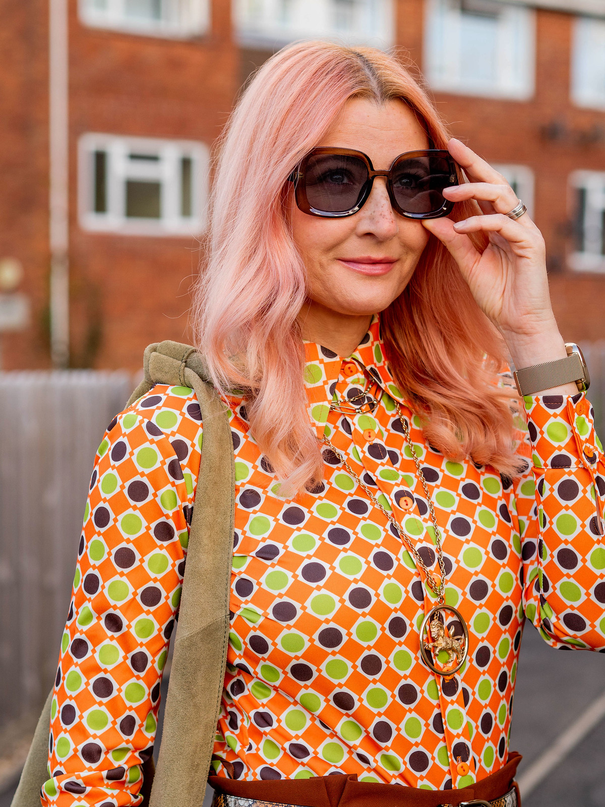 Styling a Vintage 70s Shirt With Vintage Jewellery: Catherine Summers is wearing an orange, green and brown patterned vintage 70s shirt with gold jewellery, brown paperbag trousers, pointed flats & oversized sunglasses | Not Dressed As Lamb, Over 40 Style