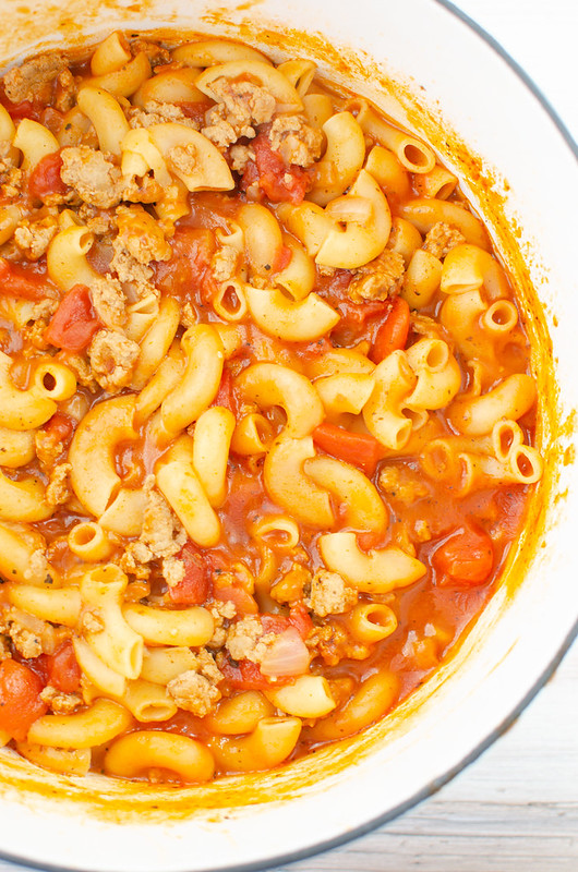 Pasta with ground turkey and tomato sauce in a white pot