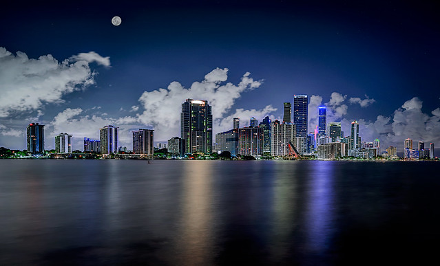 Moon over Miami.  View of moon and Miami skyline from the Rickenbacker Causeway, Miami, Florida.