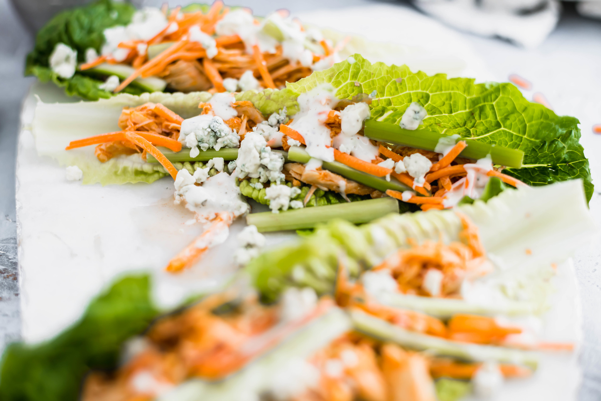 Buffalo Chicken Lettuce Wraps make for an easy, healthy and delicious meal. The buffalo chicken cooks in the slow cooker to make this super simple.