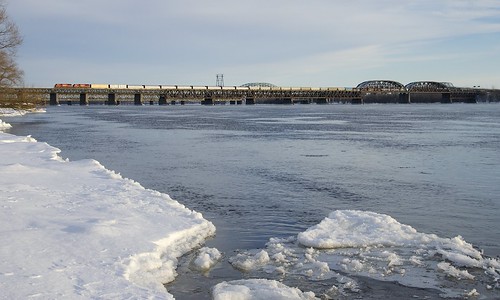 CP 251 by Michael Berry Railfan, A pair of SD60M's (CP 6258 & CP 6262) lead CP 251 over the St. Lawrence River a bit before sunse