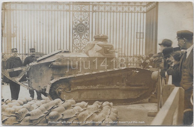 FRENCH CAMOUFLAGED TANK AND GERMAN HELMETS IN PARIS