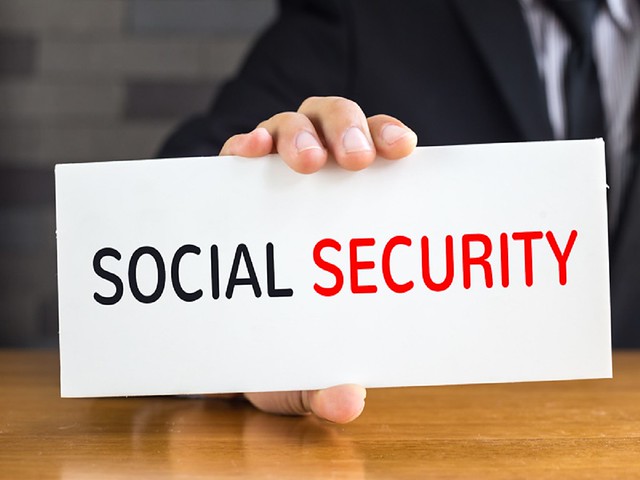Social security, message on white card and hold by