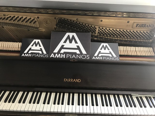 Farrand Black Upright Piano with Tuning Pins and Hammers Shown