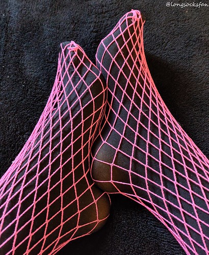 Pink fishnets over black tights | longsocksfan | Flickr