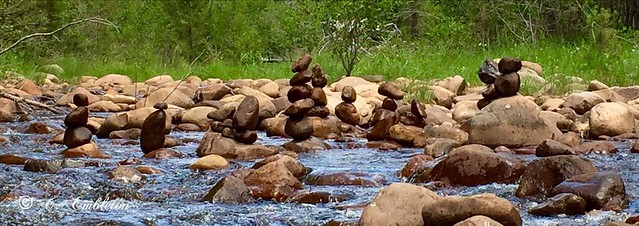 A relaxing day stacking rocks in the river.
