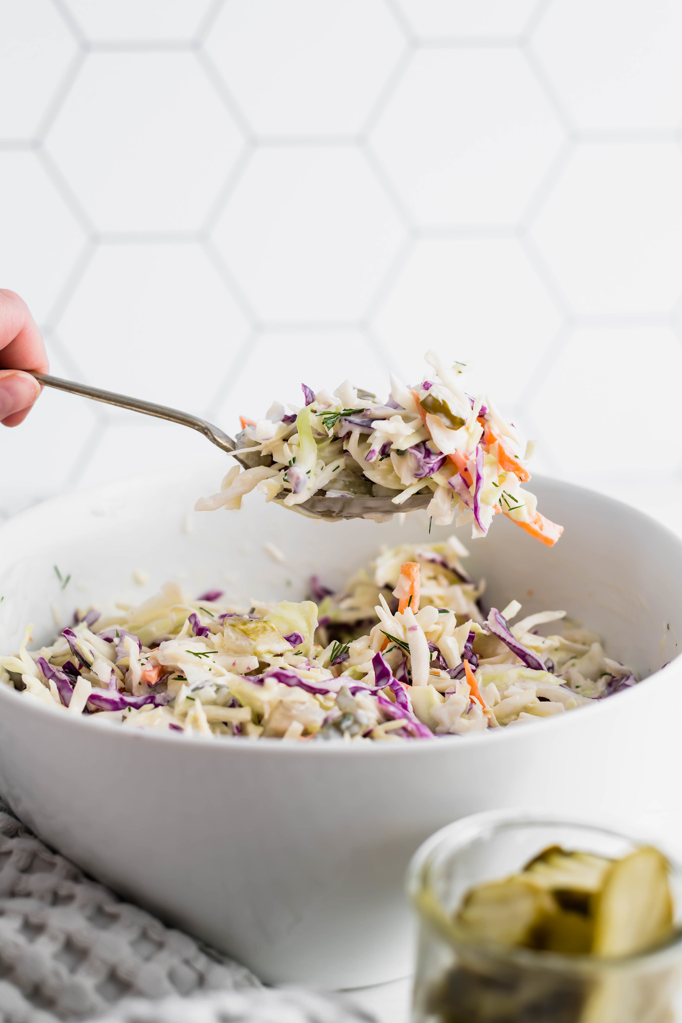 Change up your classic coleslaw with this Dill Pickle Coleslaw. Creamy dressing spiked with pickle juice, chopped pickles and fresh dill brings all the pickle flavor.