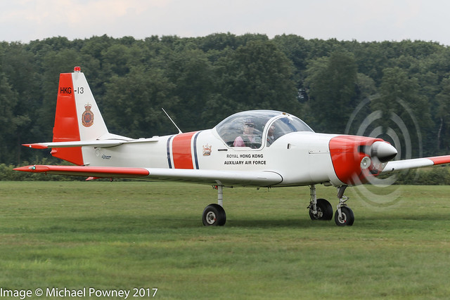 G-BXKW - 1988 build Slingsby T.67M-200 Firefly, taxiing to parking on arrival at Schaffen-Diest during the the 2018 International Old Timer Fly-In