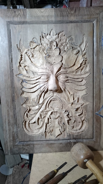 Green man in Oak with left sided hard lighting by SDB Designs carved by Sean Broadbent