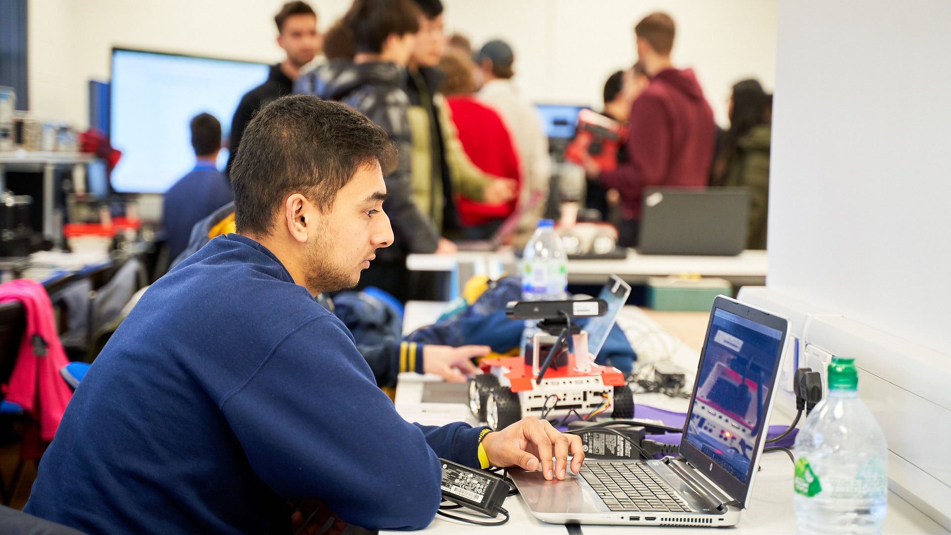 Akshil Patel working on a laptop