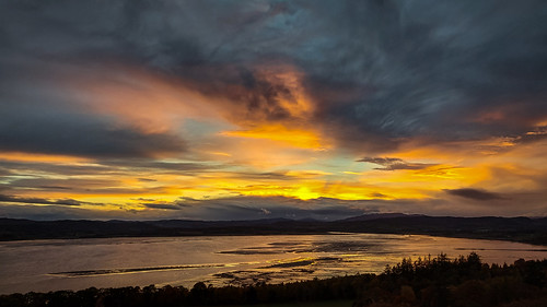 blackisle rosshire highlands scotland beauly firth sea estuary mountains hills woods trees sunset sun colour color sky clouds reflection