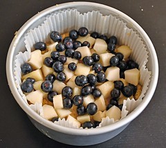 Pear and bluberry cake being assembled