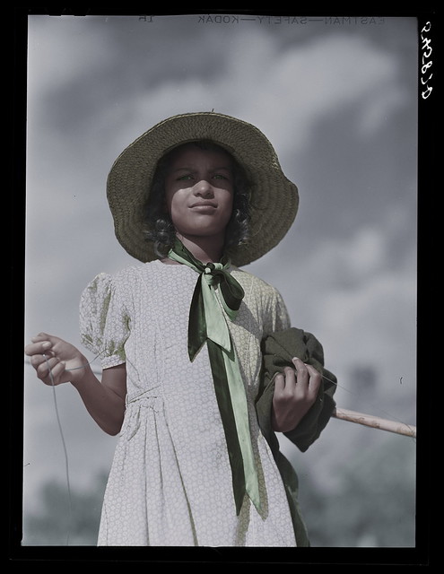 Daughter returning home after fishing 1940