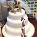 Claw mark wedding cake with dino toppers