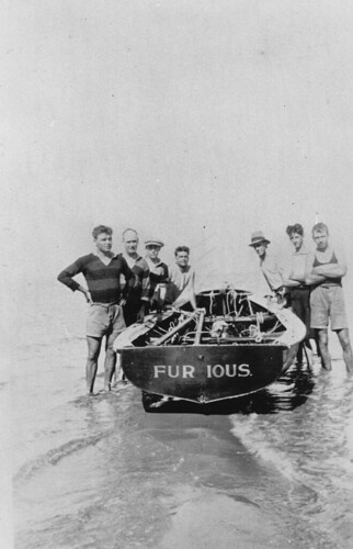 Crew standing next to the boat Furious on Bird Island during Easter, 1924 by State Library of Queensland, Australia, <strong>Creator: </strong> Unidentified.

<strong>Location:</strong> Bird Island, Queensland. 

<str