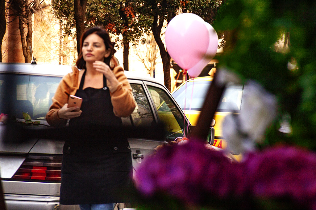 Woman with balloons on 3-30-21--Tirana