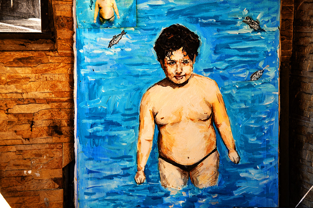 Painting of fat boy in ocean on 4-1-21--Tirana
