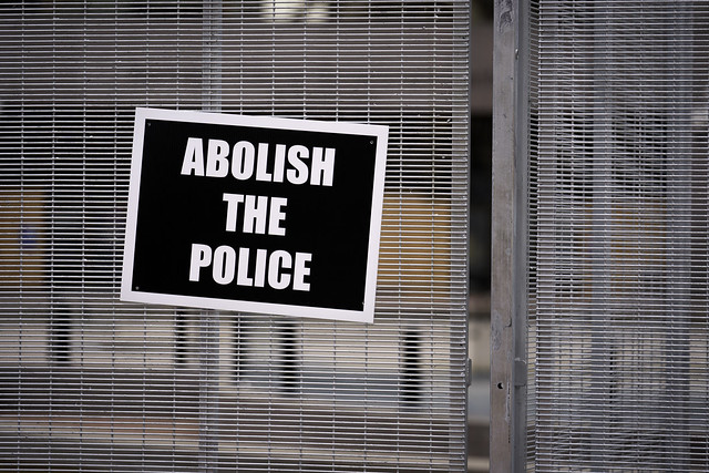 A sign that reads 'Abolish The Police' attached to the security fencing surrounding the Hennepin County Government Center as the trial continues for former Minneapolis police officer Derek Chauvin in Minneapolis, Minnesota