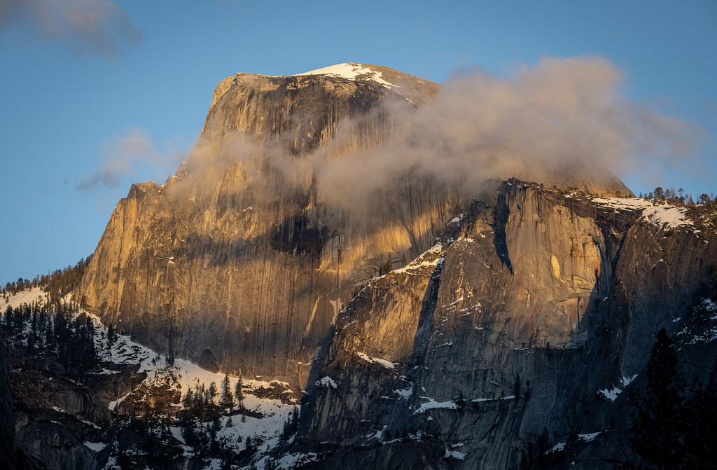 Cloud-wrapped Half Dome near sunset