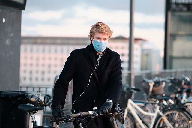 Cyclist with coivd-19 face mask in Copenhagen, Denmark