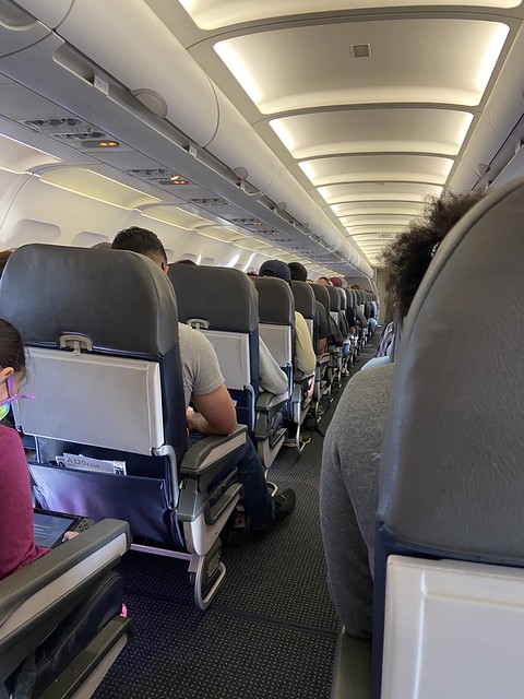 Alcohol wipe is all you need to board a flight with hundreds of other people sitting sitting side-by-side!  Alcohol wipes compliments of American Airlines Flight crew Hartford to Charlotte flight AA2345, as you board the airplane.