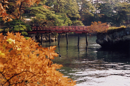 red bridge leading to a temple in Matsushima